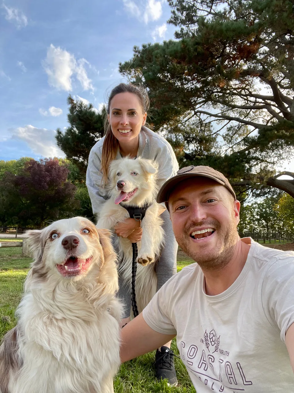 Kyle and Kelly outside with three of their dogs